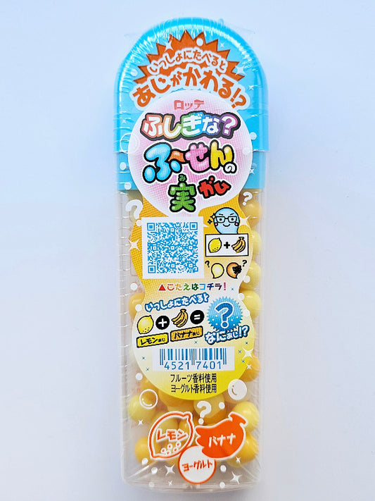 A small and colourful pocket-size container of bubble gum in lemon and banana flavours.